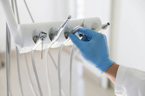 Professional Tooth Extraction technician working in St. Charles, MN